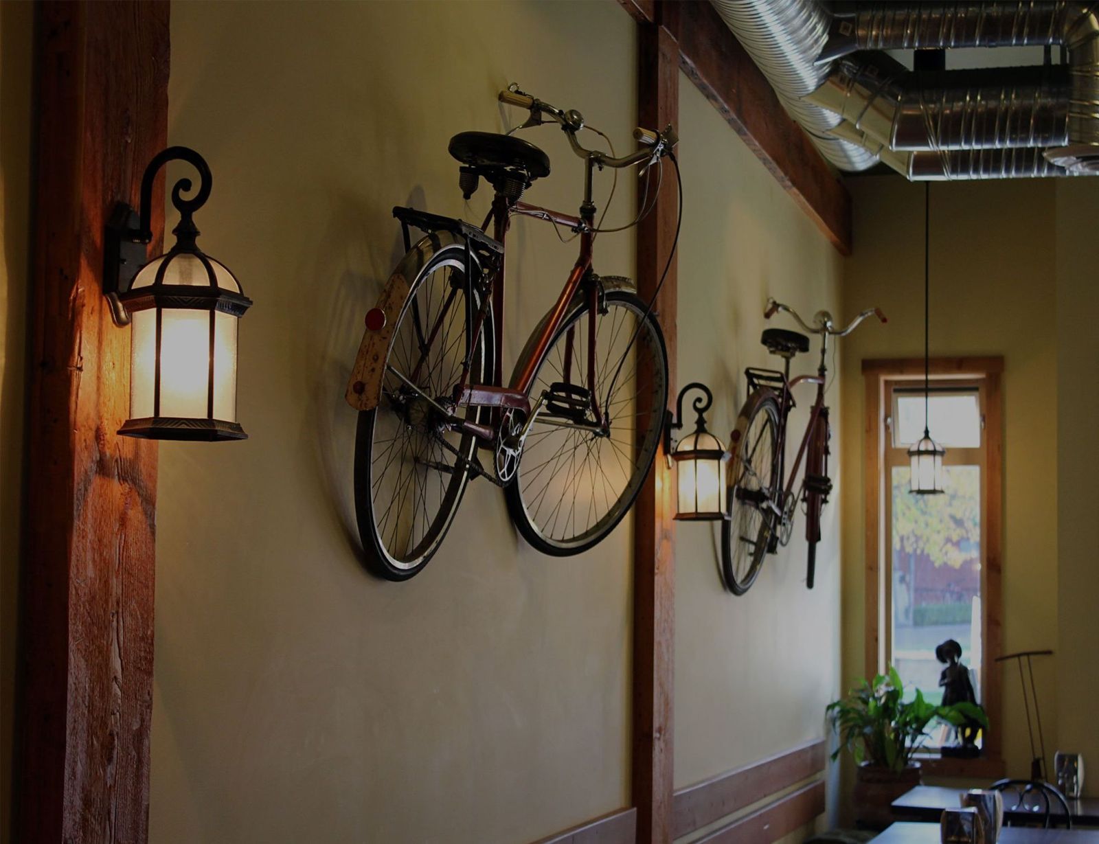 Vintage bicycles and lanterns on the cafe wall